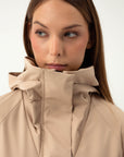 SAND COLORED RAINCOAT WITH HIDDEN HOOD