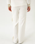 JERSEY WHITE PANTS WITH GOLDEN DETAILS
